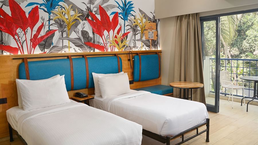 Twin beds in Cozy Twin Room at Indie Stays Resort, Goa.